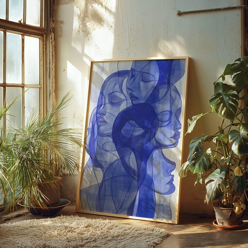 a large abstract painting with blue and white colors, displayed on a wall next to a window and surrounded by potted plants.