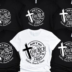 May include: A collection of black and white t-shirts with a religious theme. Each shirt features a circular design with a cross and the text "Ain't No Church Like The One I Got". The phrase "Custom Church Name" is also included.