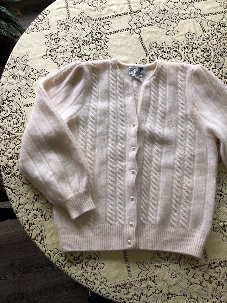 cream colored cardigan sweater