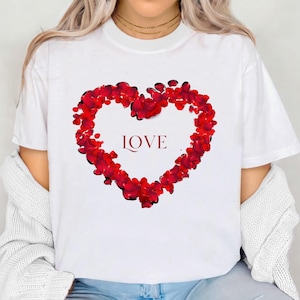 May include: White t-shirt with a red heart made of rose petals and the word "LOVE" in red lettering.