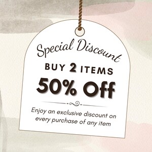 May include: A white tag with a brown string hanging from the top. The tag has the text "Special Discount" in a cursive font. Below the text is "BUY 2 ITEMS 50% Off" in a bold font. The text "Enjoy an exclusive discount on every purchase of any item" is below the discount offer.