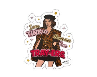 May include: A sticker featuring a cartoon illustration of a woman in a leopard print outfit and a black beret. The sticker includes text that reads "I am Tinkin there are Tray-ers". The design is outlined in black and includes star and diamond accents.