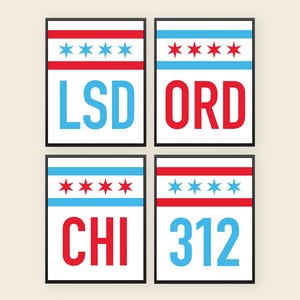 May include: Four framed art prints featuring Chicago-themed designs. Each print has a white background with a red and blue color scheme. The prints display the text "LSD", "ORD", "CHI", and "312", along with the Chicago flag.