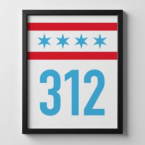 May include: Framed print featuring the Chicago city flag design with four blue stars and red stripes, above the number "312" in blue. The artwork is displayed in a black frame, suitable for wall decor.