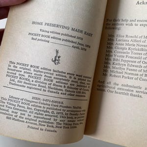 May include: A vintage book cover for "Home Preserving Made Easy" with a yellowed background and black text. The book was published in 1975 by Viking and has a second printing from April 1976.