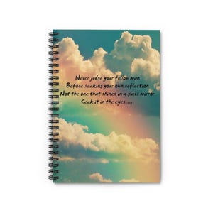 May include: A spiral bound notebook with a colorful sky background and the quote "Never judge your fellow man Before seeking your own reflection Not the one that shines in a glass mirror Seek it in the eyes....."