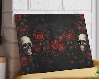 May include: A rectangular decorative panel featuring a dark background with red roses and two white skulls. The roses are in full bloom, and the skulls are detailed with visible teeth and eye sockets. The overall theme is gothic.