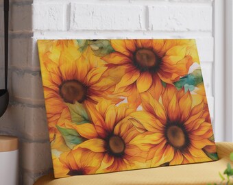 May include: A rectangular cutting board featuring a watercolor design of sunflowers. The sunflowers have yellow petals with reddish-brown centers and green leaves. The board is displayed on a yellow surface.