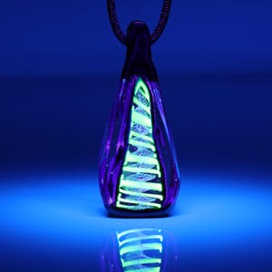 DRIP DROP #68 Handblown glass necklace pendant with dichroic swirl core, uv reactive wrap and dichroic overlay.