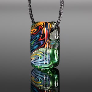 May include: A rectangular glass pendant with a swirling pattern of vibrant colors, including red, orange, blue, and green. The pendant is suspended from a black cord, showcasing a unique, artistic design. The glass has a reflective quality.