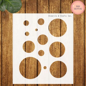 May include: A set of three ceramic mugs with a speckled, matte finish. The mugs are in shades of cream, light gray, and dark gray. Each mug has a simple, minimalist design and a rounded handle.