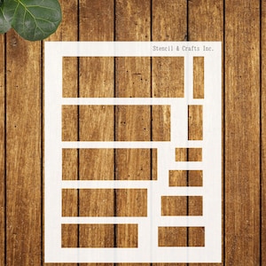 May include: A white stencil with a set of rectangular shapes of varying sizes. The stencil is on a wood background. Stencil & Crafts Inc. is printed in the top right corner.