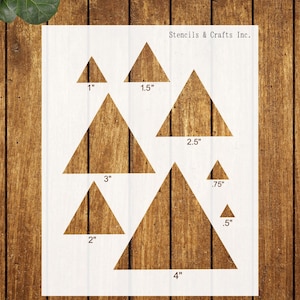 May include: White stencil sheet featuring various-sized triangle shapes with measurements in inches: .5", .75", 1", 1.5", 2", 2.5", 3", and 4". The text "Stencils & Crafts Inc." is printed at the top.