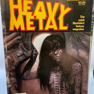 May include: A vintage magazine cover featuring a woman with dark hair and a black and white patterned body. The magazine is titled "Heavy Metal" and the cover story is "Deborah Harry meets Alien artist H. R. Giger".
