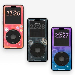 May include: Three smartphones with retro-style designs. Each phone displays a digital clock and a music player interface. The phones have different colour schemes: pink, grey, and blue, with decorative stickers.