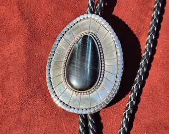 Hawk&#39;s Eye sterling silver bolo tie - black cabachon (Australian) in sterling silver with geometric pattern embellishment - black leather
