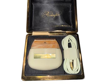 Afeitadora eléctrica Remington 60 Deluxe vintage con estuche. Probada y en funcionamiento.