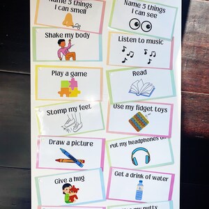 May include: A colourful chart with 12 different calming activities for children. The activities include: name 5 things I can smell, shake my body, play a game, stomp my feet, draw a picture, give a hug, use my calming sensory bottle, name 5 things I can see, listen to music, read, use my fidget toys, put my headphones on, get a drink of water, and use my putty.