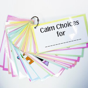 May include: A set of colourful cards with images and the text "Calm Choices for" on the top card. The cards are attached together with a metal ring.
