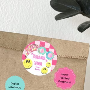 May include: Pink and white thank you sticker with a disco ball, flowers, and smiley faces. The sticker says "Thank You! xoxo, Tatum".  The sticker is on a brown paper bag with a pink sticker that says "Hand Painted Graphics!"