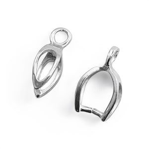 May include: Two silver-toned metal bead caps with a teardrop shape. The caps have a small loop at the top for attaching to a chain or cord.