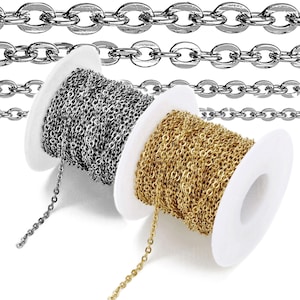 May include: Two spools of chain, one gold and one silver, are shown against a white background. The chain is wound around the spools and is ready to be used for jewellery making.