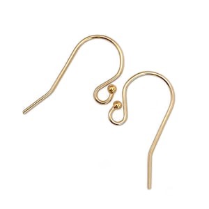 May include: Two gold-colored earring hooks on a white background. Each hook has a curved design with a small ball accent near the bottom. The hooks are made of a shiny, metallic material.