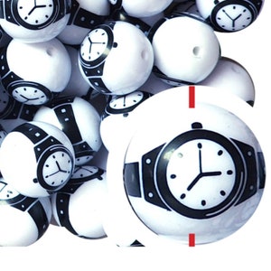 May include: White round beads with a black watch face design. The watch face features a black bezel, watch band, and hands. The beads are a mix of solid white and watch face designs.