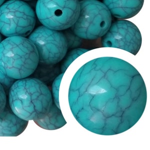 May include: Turquoise blue round beads with a marbled pattern. The beads are smooth and have a glossy finish.