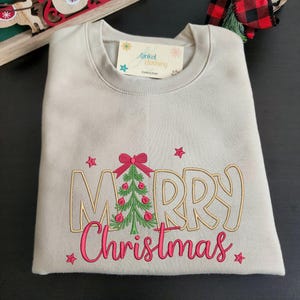 Holiday Fashion Sweatshirt Christmas Embroidered Design Festive Tree Detail Winter Apparel Casual Outfit Soft Cotton Blend Comfortable Fit Seasonal Clothing Multiple Color Options Size Range Available Christmas Party Wear Celebration Outfit