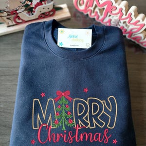 Festive Christmas Sweatshirt Embroidered Tree Design Holiday Apparel Winter Fashion Statement Cotton Blend Material Comfortable Casual Wear Seasonal Clothing Multiple Sizes Available Color Options Include Beige Black Green Pink White