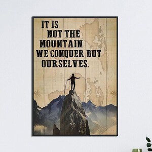 May include: A motivational quote on a vintage map background with a silhouette of a person standing on a mountain peak. The quote reads "It is not the mountain we conquer but ourselves."