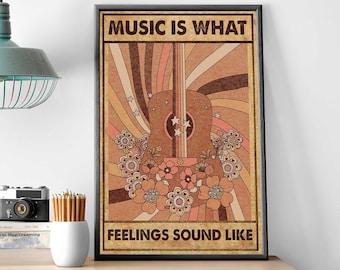 May include: A framed vintage-style poster with the text "MUSIC IS WHAT FEELINGS SOUND LIKE." The artwork features a brown guitar with floral accents and a retro color scheme of browns, oranges, and pinks, with star details.