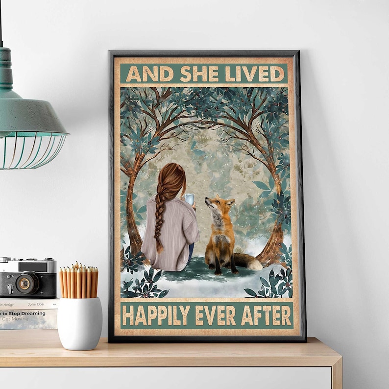 May include: A vintage-style poster with a woman sitting in a snowy forest with a fox. The text reads "And she lived happily ever after".