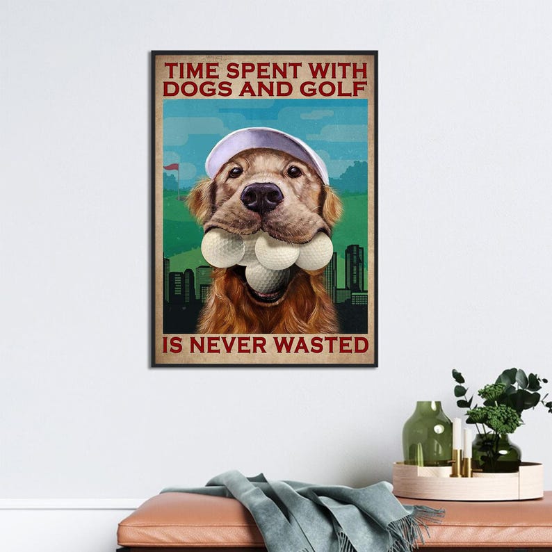 May include: A golden retriever dog wearing a white golf cap and holding several golf balls in its mouth. The dog is in front of a green golf course with a city skyline in the background. The text "TIME SPENT WITH DOGS AND GOLF IS NEVER WASTED" is printed in red on a white background.