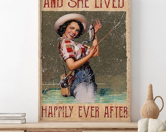 May include: A vintage-style poster featuring a woman in a plaid shirt and denim jeans, holding a fishing rod and a fish. The text "AND SHE LIVED" is at the top, and "HAPPILY EVER AFTER" is at the bottom. The image has a distressed, aged look.
