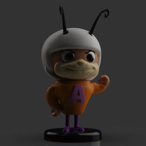 Puede incluir: Una figurita de personaje de dibujos animados con un casco blanco, un cuerpo naranja y botas moradas. El personaje tiene una nariz grande y marr&oacute;n y una letra "A" morada en el pecho. La figurita est&aacute; de pie sobre una base negra.