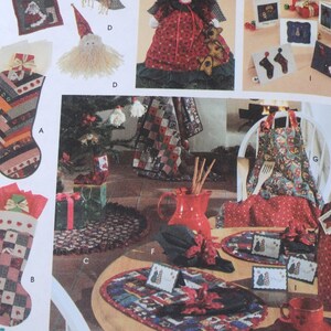 May include: A collection of Christmas-themed crafts and decorations. Includes stockings, a Santa Claus doll, greeting cards, an apron, and a table setting with placemats, napkins, and a red pitcher. The items feature festive patterns and colors.
