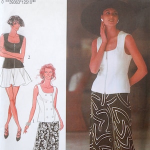 May include: A fashion sewing pattern featuring illustrations of women's clothing designs. The designs include a white zip-up top, black and white patterned pants, and a white top with buttons. The image also shows a woman wearing a white top and patterned pants.