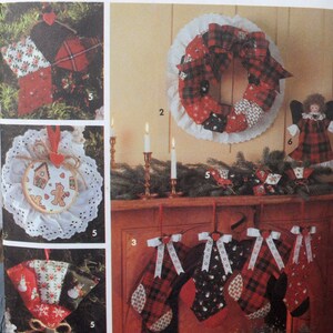 May include: A collection of handmade Christmas decorations, including a wreath, stockings, ornaments, and an angel. The items feature red, black, and white plaid and floral patterns. The wreath is surrounded by a white lace doily.