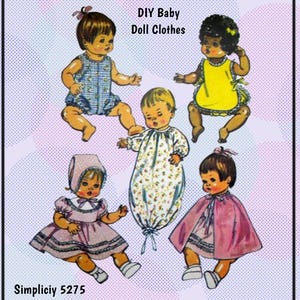 May include: A vintage Simplicity sewing pattern for making baby doll clothes. The pattern is number 5275 and includes five different outfits: a blue and white gingham dress, a yellow bib, a white gown with floral print, a pink dress with a cape, and a pink dress with a bonnet.