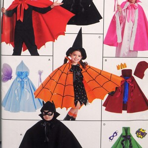 May include: A sewing pattern for making children's Halloween costumes. The pattern includes designs for a devil, a witch, a princess, a spider, a bat, and a superhero. The pattern is printed on a white background with black text and illustrations.