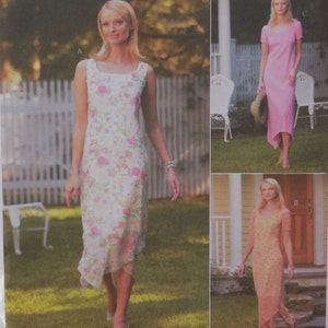 May include: A magazine page featuring three dresses. One is white with pink and green floral patterns, another is solid pink, and the third is peach with a floral design. The text "SewNews" and "Cut-to-Fit" are visible.