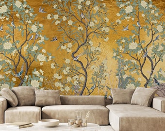 May include: A gold background with a floral pattern and birds. A beige sectional sofa with a coffee table in front of it.