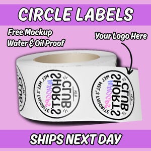 May include: A roll of white circle labels with black text and a logo. The text "CIRCLE LABELS", "Free Mockup", and "Water & Oil Proof" are displayed. The labels are designed for custom logos.