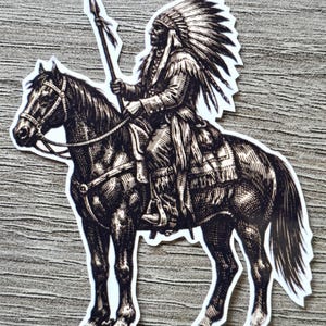 May include: A black and white sticker illustration featuring a person wearing a traditional feathered headdress and fringed clothing, riding a horse while holding a long spear. The artwork uses detailed cross-hatching lines to create texture.