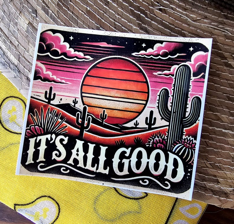 May include: A retro-style illustration of a desert sunset with the text "IT'S ALL GOOD" in a bold, vintage font. The image features a large orange sun with stripes, cacti, and a dark blue sky with pink clouds.