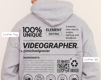 May include: A light gray hoodie with the text "100% UNIQUE VIDEOGRAPHER" and a list of ingredients. The hoodie features a QR code, icons, and the text "@michaelgracier". The back of the hoodie also has the text "ELEMENT EDITING".