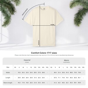 May include: A cream-colored short-sleeve t-shirt displayed with a size chart labeled Comfort Colors 1717. The chart provides width, length, and sleeve length measurements in both inches and centimeters for sizes ranging from XS to 5XL.