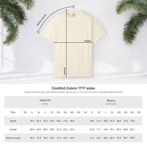 May include: Cream-colored Comfort Colors 1717 t-shirt with measurements chart. The chart shows width, length, and sleeve length in inches and centimeters. The shirt's width ranges from 18.3 to 29.8 inches.